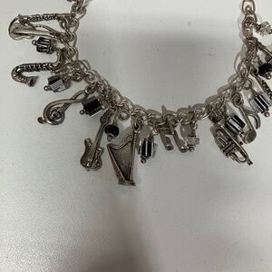 Sterling silver charm bracelet musical themes.